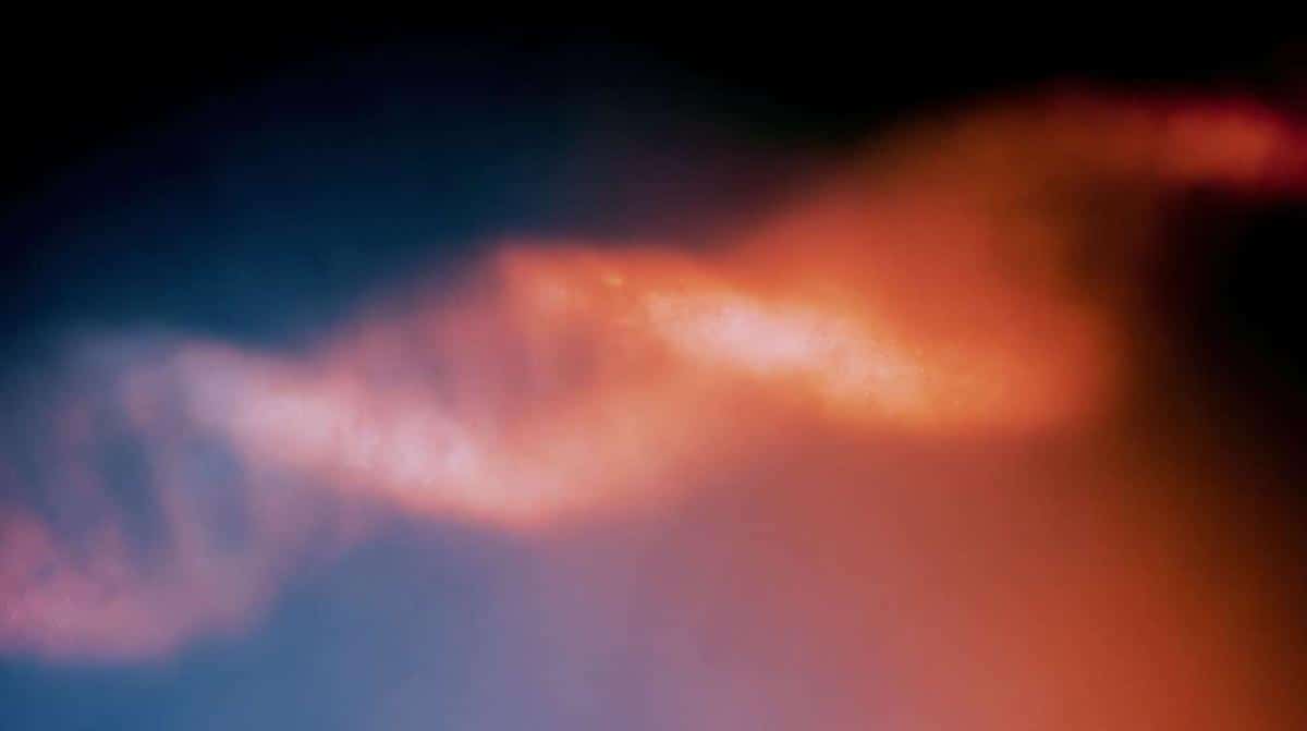 A helix of glass, orange against blue